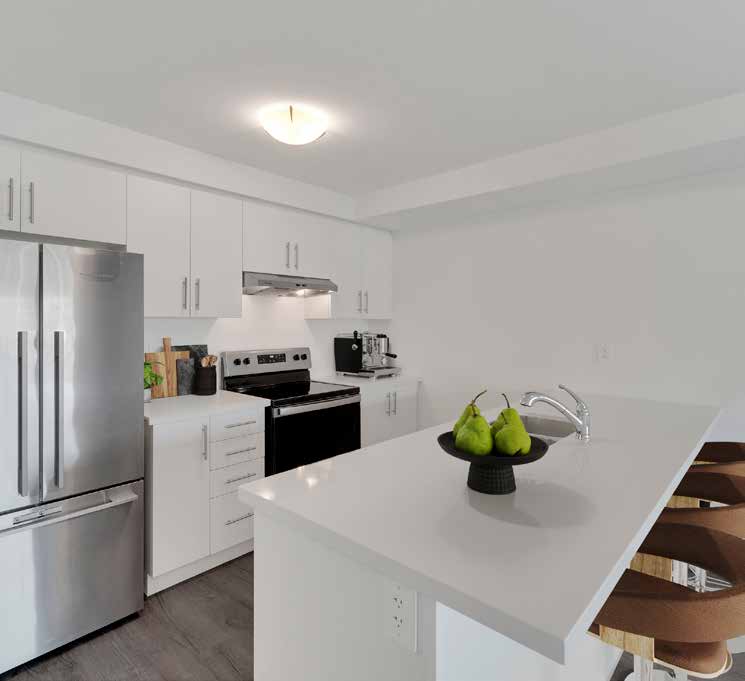 Bright white Aquamarine kitchen with quartz island